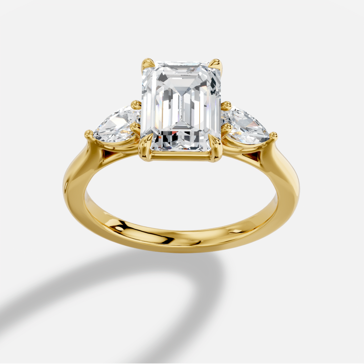 Emerald Cut Three Stone Diamond Ring in 18K Yellow Gold
