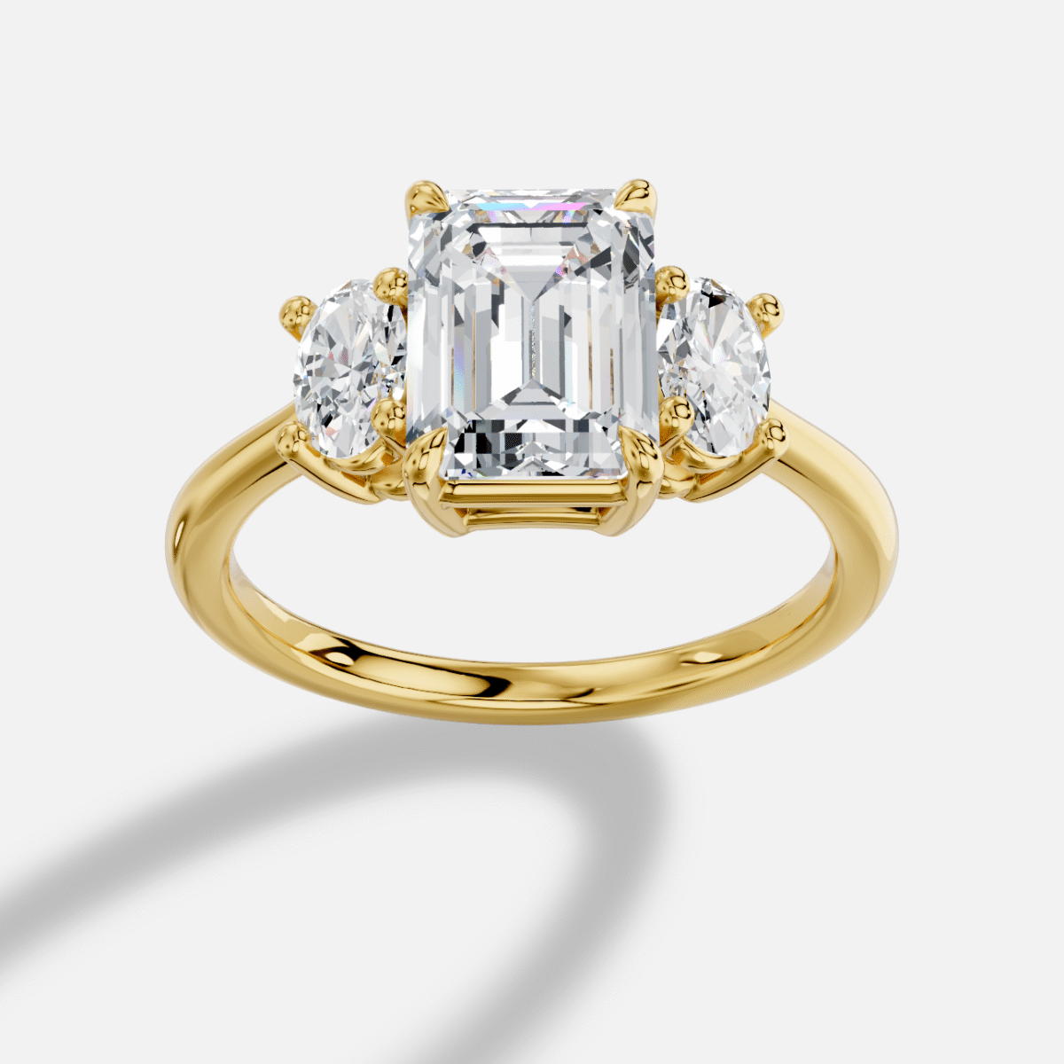 Emerald Cut Three Stone Diamond Ring in 18K Yellow Gold