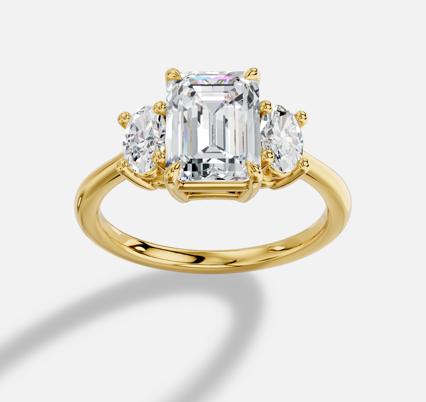 Emerald Cut Three Stone Diamond Ring  in 18K Yellow Gold