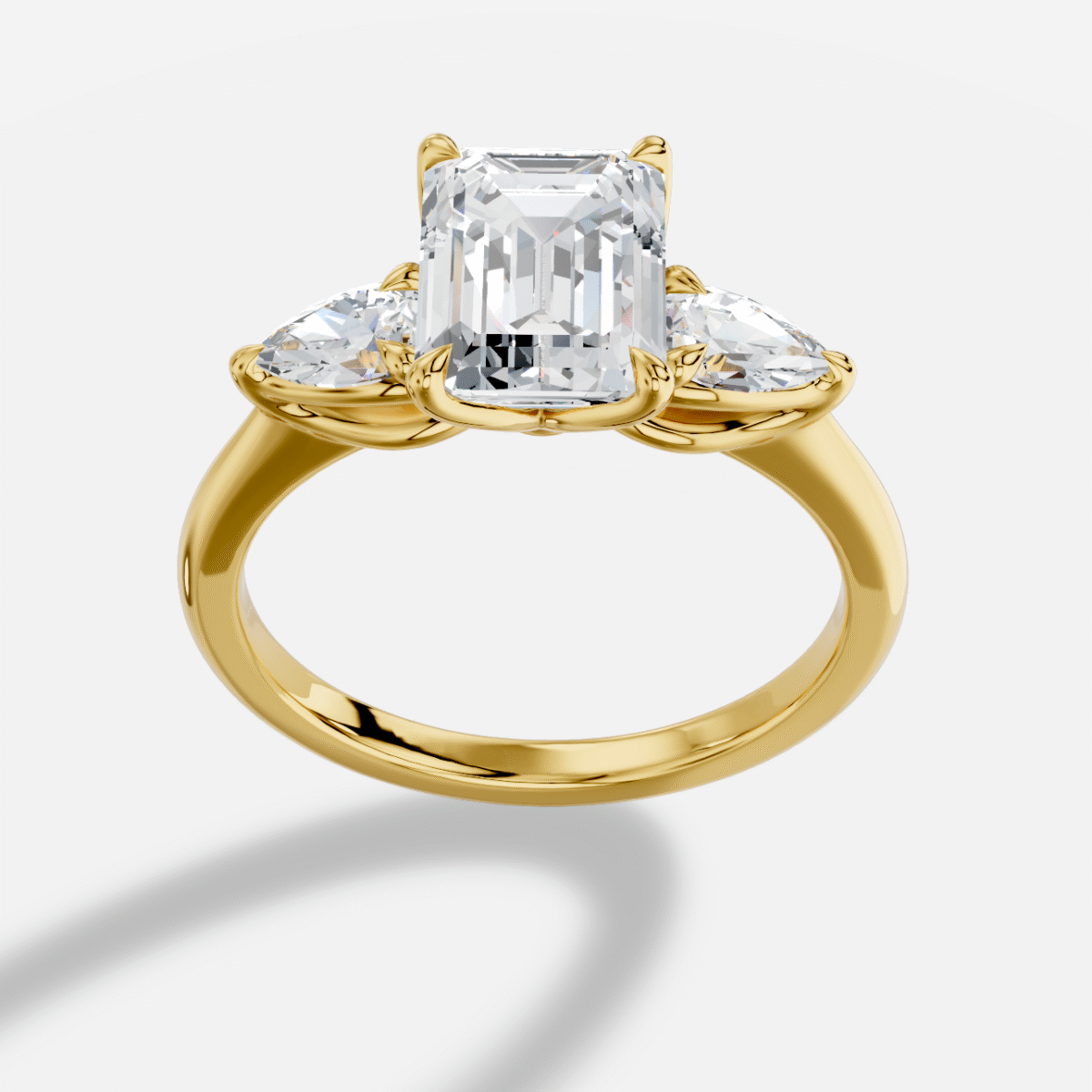 Emerald Cut Three Stone Diamond Ring  in 18K Yellow Gold